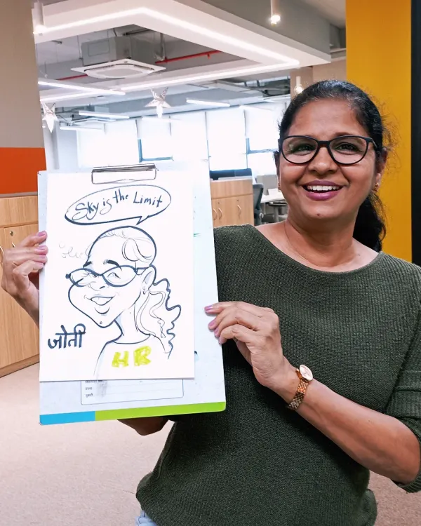 Bringing some artistic fun to the office. This HR professional loved her caricature with the inspiring "Sky is the Limit" message.