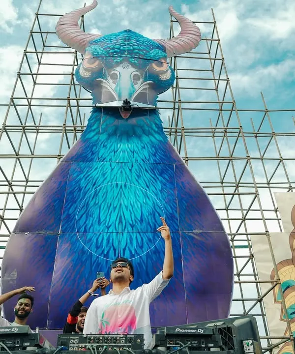 Performing at a Holi festival with this incredible, massive stage art behind me. The scale of these events is just breathtaking.