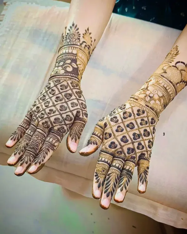 A classic back-hand design featuring a full-coverage jaali (net) pattern, accented with a beautiful floral cuff at the wrist.