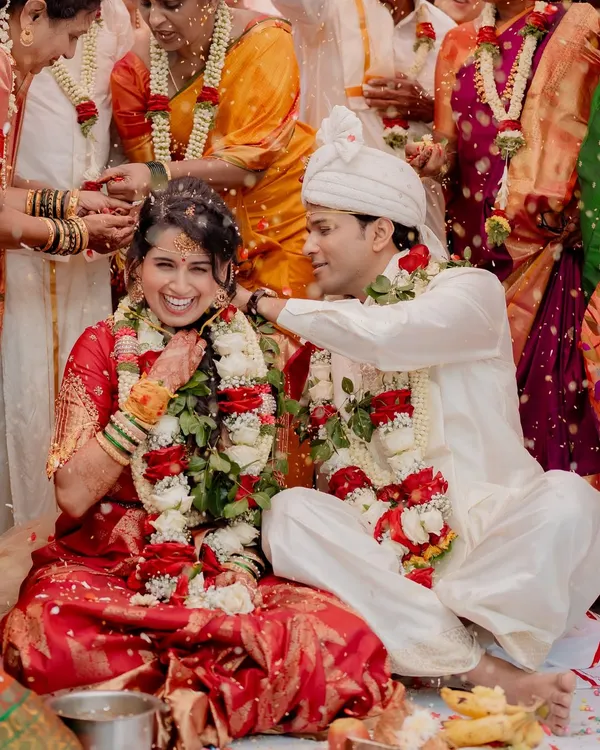 A candid moment of pure joy during A & N's Muhurtham. The laughter and showering of blessings from family create a memory filled with warmth and happiness.