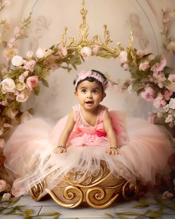 A princess theme photoshoot with a beautiful floral arch and a royal seat. I have a wide variety of gowns and props to make your little girl feel like royalty for a day.