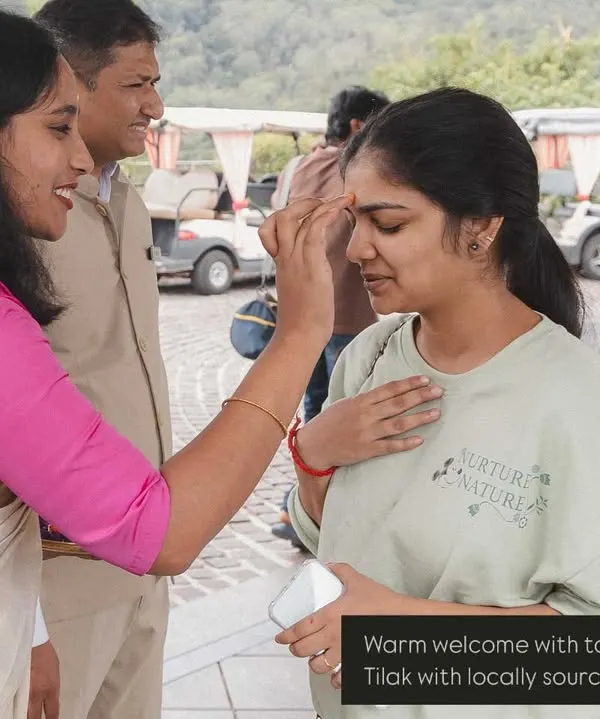 A warm, traditional welcome for guests arriving at a destination wedding. We greet everyone with a tilak and locally sourced flowers to make them feel special from the very first moment.