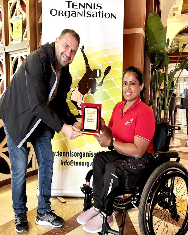 One of our star wheelchair tennis players receiving the women's doubles runner-up award at the TTF Cup. Her success on the international stage is an inspiration to our entire community.