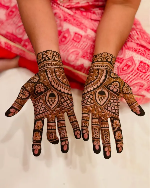 A rich and detailed mehendi design for the bride's mom, filled with traditional motifs to make her feel just as special.