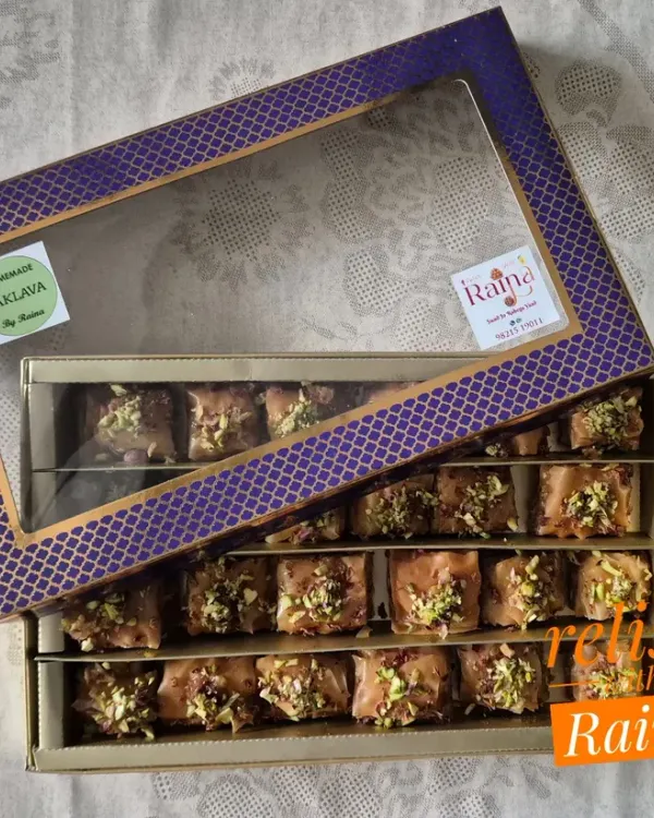 A beautiful gift box of my homemade Square Baklava. This rich Turkish pastry is made with layers of phyllo, filled with pistachios and almonds, and soaked in a jaggery-honey syrup.