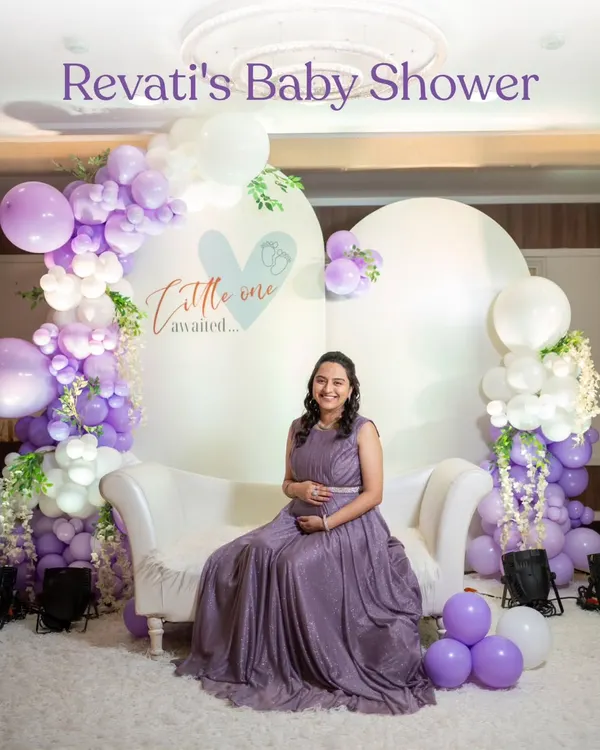 The beautiful mom-to-be at her baby shower. We designed this "Little One Awaited" backdrop with soft colours and balloons to create the perfect photo spot.