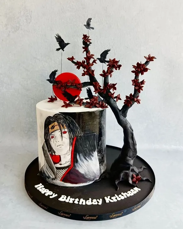 An Itachi Uchiha-themed cake for a true anime fan. This design features a hand-painted portrait of the character and a sculpted sugar tree with crows. The client shared a reference from another artist, and I hope we did it justice.