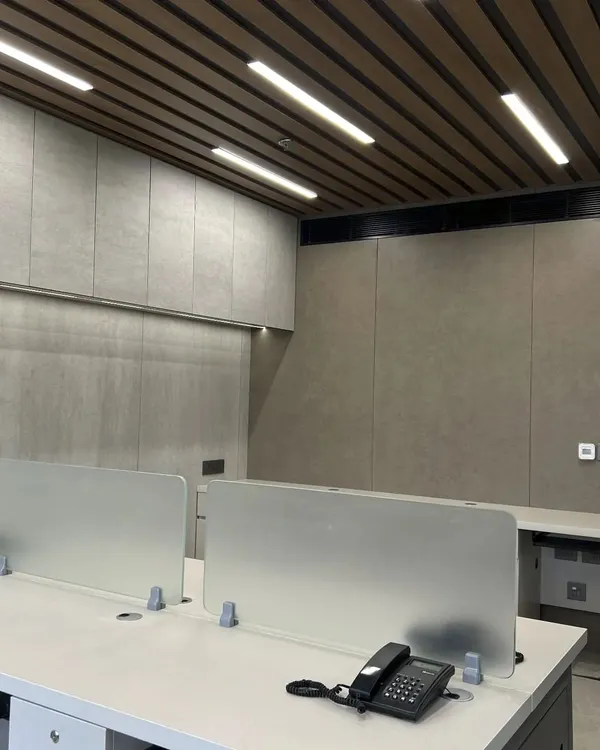 This finished office design offers the best of both worlds. Open spaces with ample lighting create a vibrant environment, while strategic privacy elements ensure focus and comfort.