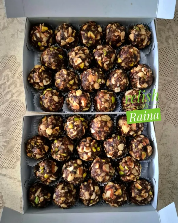 Two boxes of my popular sugar-free Dryfruit Laddoos, ready for delivery. Each laddoo is loaded with crunchy nuts like cashews and pistachios, held together by sweet dates.