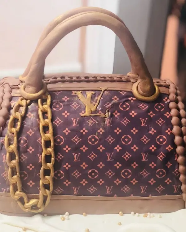 This 3D LV bag cake is a masterpiece of edible luxury. I meticulously recreated the iconic monogram pattern, gold chain, and bag structure, making it a showstopper for any fashion-forward celebration.