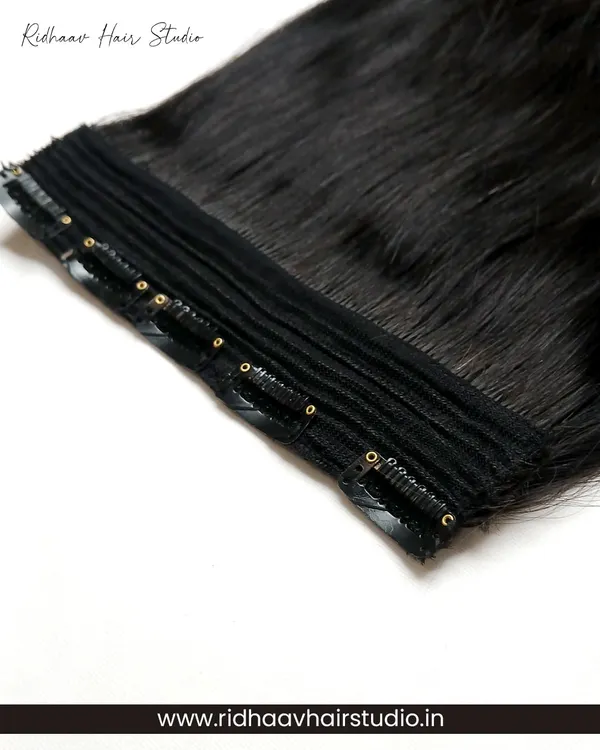 A close-up of our 5-clip ear-to-ear straight clip-in extension. The strong, secure clips ensure the extension stays in place all day, providing instant and reliable volume.
