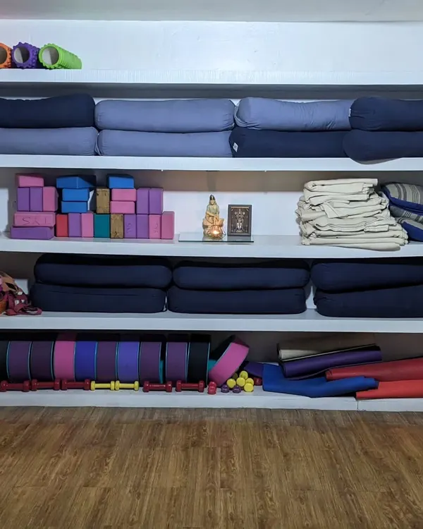This is our wall of props at the studio. I see these not as crutches, but as tools for exploration, support, and deeper stretching in every yoga asana.