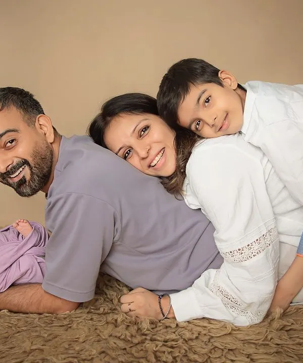 A pile of love! This is what family is all about. I gently pose everyone together to create a portrait that is full of warmth, smiles, and the joy of your complete family.