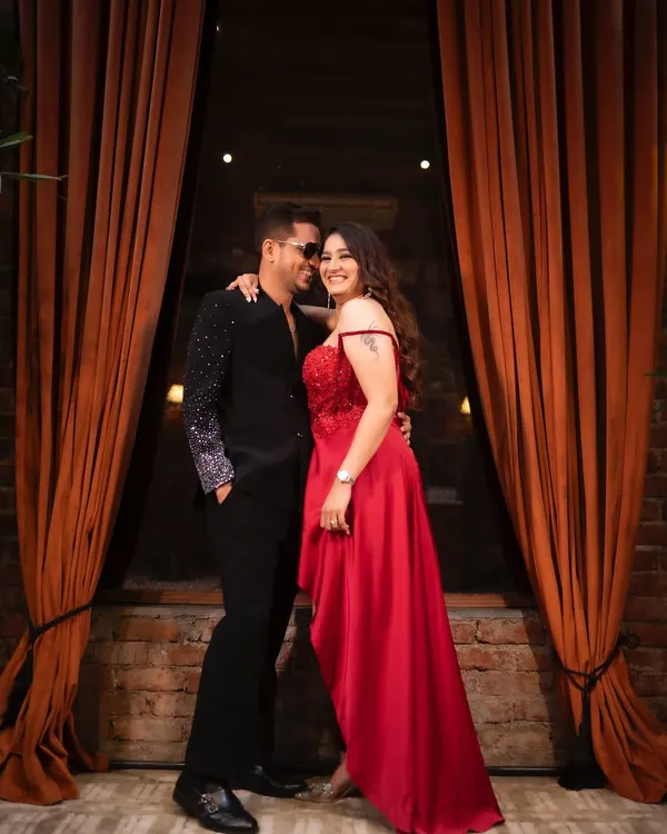 Kicking off the cocktail night with style. Jinal's glamorous makeup and chic red dress create a stunning look, perfect for an evening of celebration.