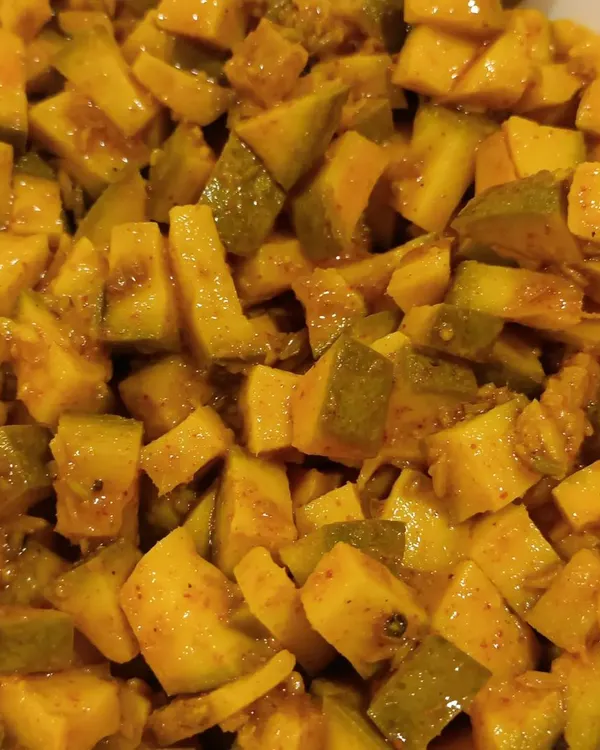 These are the small, bite-sized cubes of our classic Aam ka Achaar. They are perfect for mixing with rice or just having a small bite when you crave that tangy flavour.