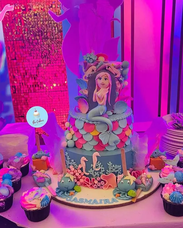 This complete mermaid-themed dessert table for Jasmaira's birthday is a great example of how I can bring a party vision to life. It features a multi-tiered custom cake, matching cupcakes, and detailed cakesicles, all designed to create an immersive underwater fantasy.