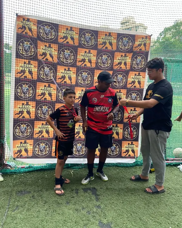 A player receiving an award at a tournament, showcasing our commitment to player development.
