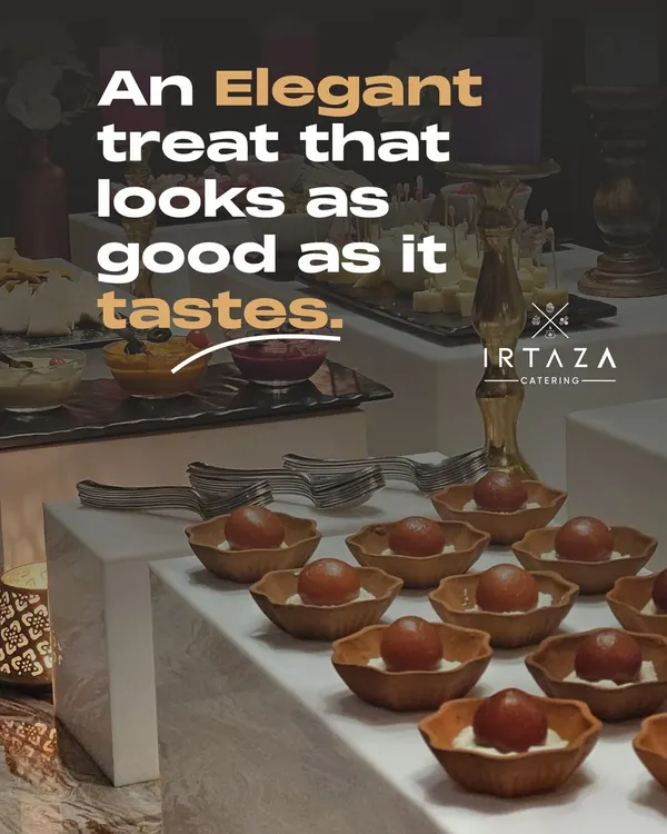 An elegant dessert spread featuring Gulab Jamun with a creamy base, served in beautiful individual bowls. It's a treat that looks as good as it tastes.
