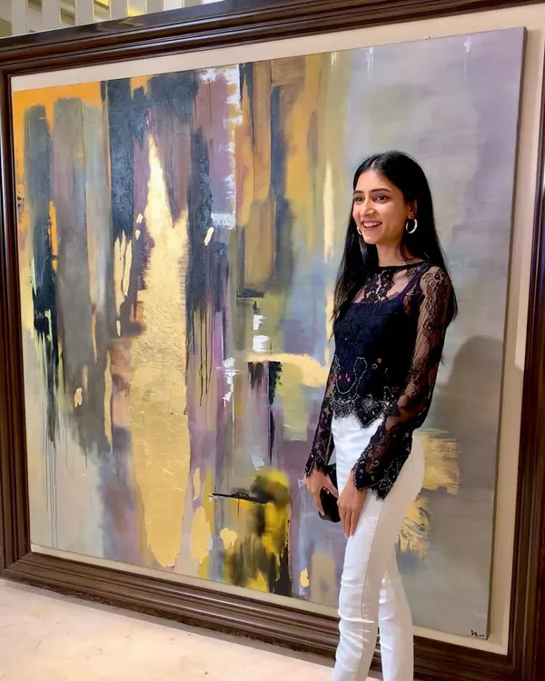 Standing next to "Dusk," a massive 6x5.75 ft custom abstract piece. This painting was commissioned to fill a large wall, using a palette of grays, purples, and shimmering gold leaf to create a dramatic, atmospheric effect.