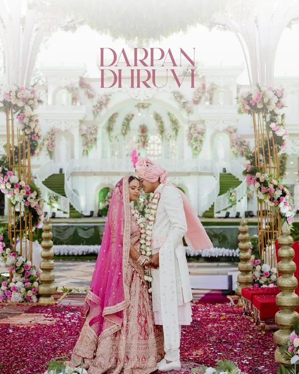 A moment of quiet connection amidst the grandeur of the wedding ceremony. We framed this shot to highlight the stunning decor and the intimate bond between the couple, creating a perfect blend of scale and emotion.