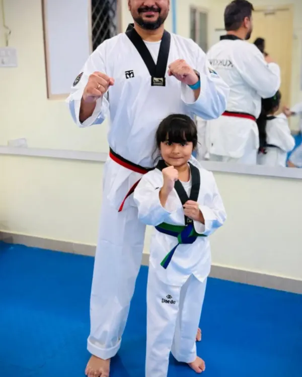 Taekwondo can be a family affair. A father and daughter duo, both training and growing together in our dojang.