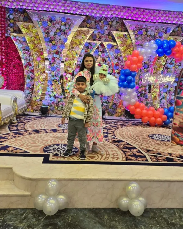 A birthday party fit for a princess. I designed this lavish stage with a massive floral wall and a custom balloon arch, creating a beautiful backdrop for the cake cutting and photos.