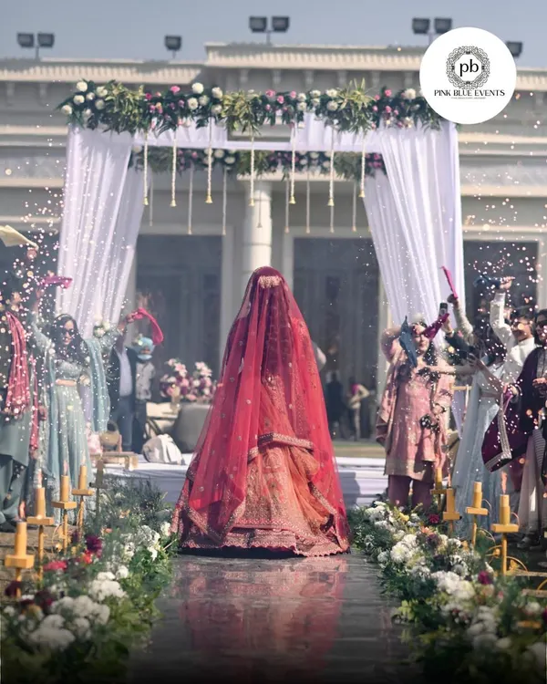 This is the moment every bride dreams of. We create breathtaking entrances like this one, ensuring your walk down the aisle is as magical as the vows you are about to take. The aisle is lined with flowers and pyrotechnics, creating a path of celebration.