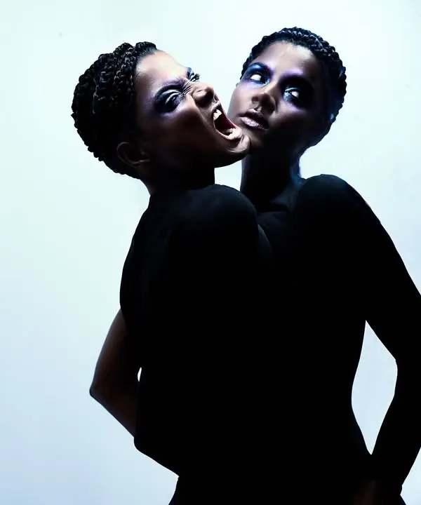A surreal portrait created by compositing two images. The concept explores duality and the inner monster, resulting in a visually shocking and memorable image.