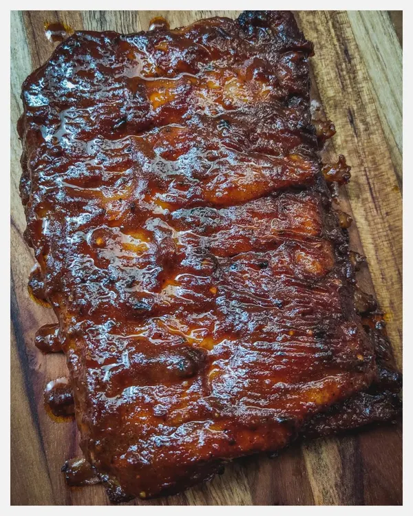 My Barbeque Pork Ribs are slow-grilled in a smoky, tangy homemade BBQ sauce until they are fall-off-the-bone tender. This is a full rack of juicy, flavour-packed ribs, perfect for sharing.