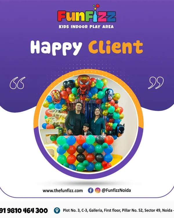 A happy family posing in front of their superhero-themed birthday decorations. It's a joy to help create these picture-perfect moments and unforgettable family memories.