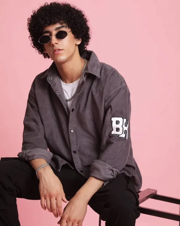 For the 'Chic Street' collection, I focused on creating a cool, urban look for men. This corduroy shirt paired with dark trousers and classic shades is a perfect example of effortless street style.