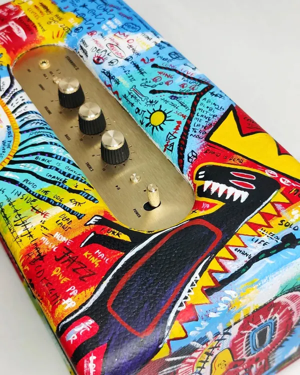 This custom-painted Marshall speaker is a great example of how I can turn everyday electronics into one-of-a-kind art. I went with a freehand street art style inspired by Basquiat, layering vibrant colors and raw, expressive details to give it a completely new identity.