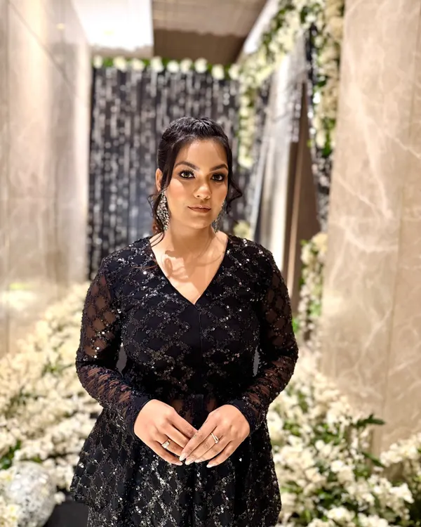 For an evening celebration, I chose this stunning all-black peplum top and sharara pants set. The intricate sequin work adds a touch of glamour, perfect for a cocktail party or reception.