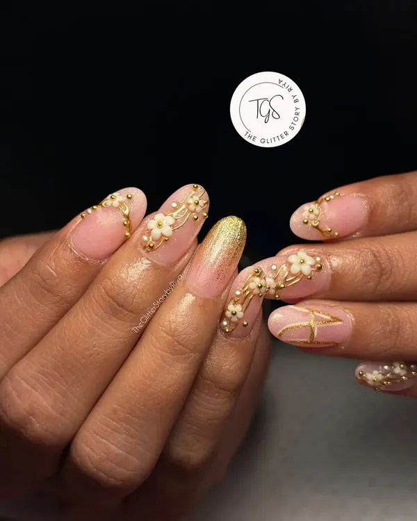 A full view of a custom bridal press-on set featuring 3D floral details, a glitter accent nail, and a personalized initial. I work with brides to create a design that is completely unique to their style.