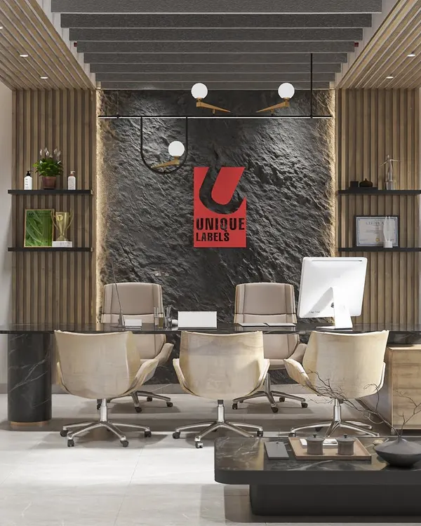 We designed this executive cabin for Unique Labels to be a statement of authority and style. The space features a dramatic raw stone accent wall, warm wood paneling, and a custom marble desk, creating an environment that is both powerful and welcoming.
