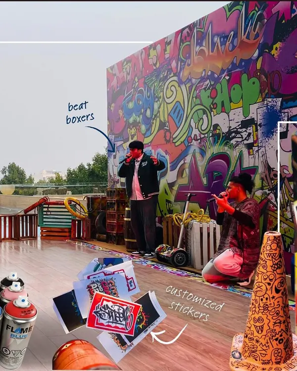 For the Hilton Hotel's GM Conference, we built an entire experience around live art. This shot captures the large-scale graffiti backdrop, the beatboxers performing, and the overall energetic atmosphere we created for the event.
