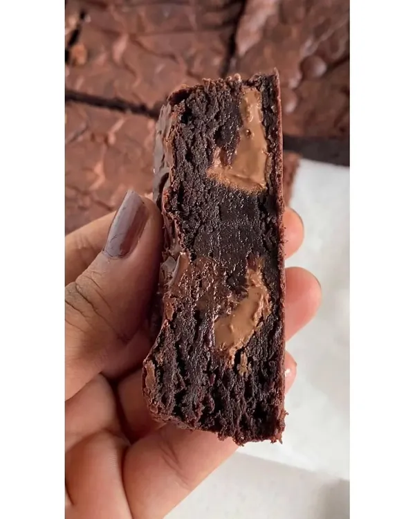 This is the texture you can expect from my gooey fudgy brownies. I use premium couverture chocolate to create that signature molten center and rich, deep flavor. All my brownies are eggless.