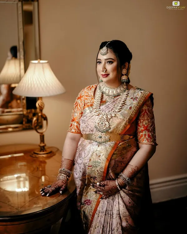 A serene and classic portrait of a glowing mom-to-be at her baby shower. The makeup was kept soft and luminous to complement her traditional attire and the joyous occasion.