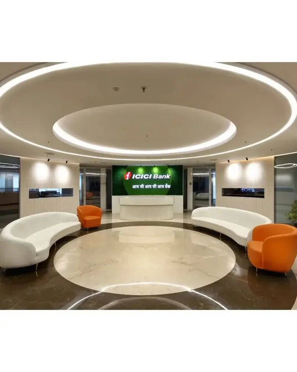 The main lobby for ICICI Bank, designed with a circular motif, marble flooring, and custom curved sofas. The space is engineered to manage high footfall while projecting an image of modern financial leadership.