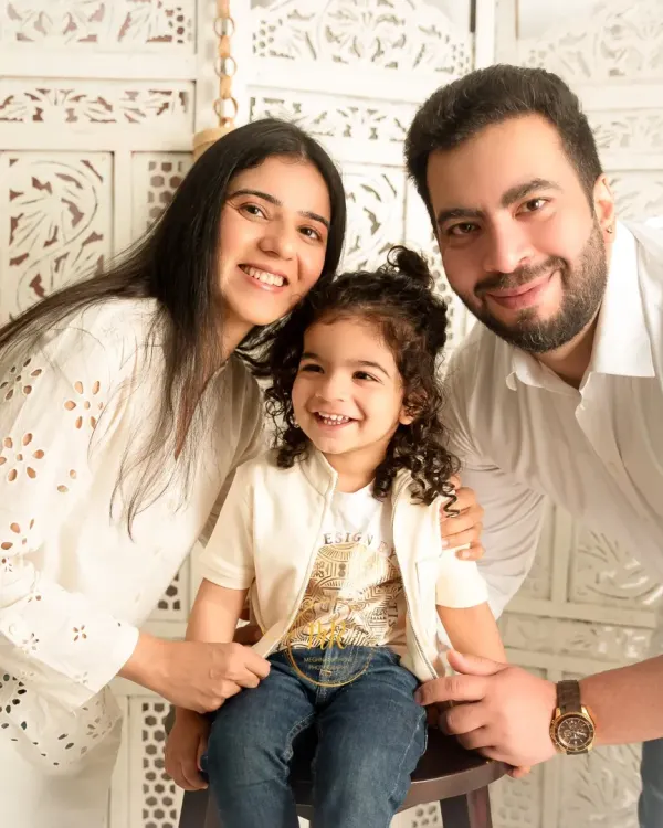 A happy and relaxed family portrait. The all-white outfits and bright studio lighting create a fresh, clean aesthetic that I love for family sessions.