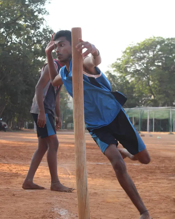 Mastering the pole is essential for any serious Kho-Kho player. Here, a player practices his pole turn, a key technique for quick direction changes while chasing.