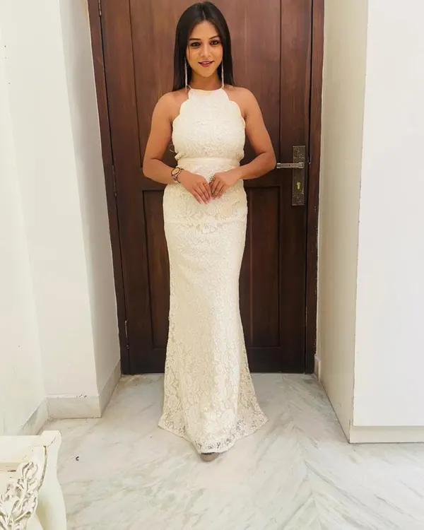 My collection also includes elegant Western wear like this white lace halter-neck gown. It's a sophisticated choice for cocktail events, formal dinners, or even a modern pre-wedding shoot.
