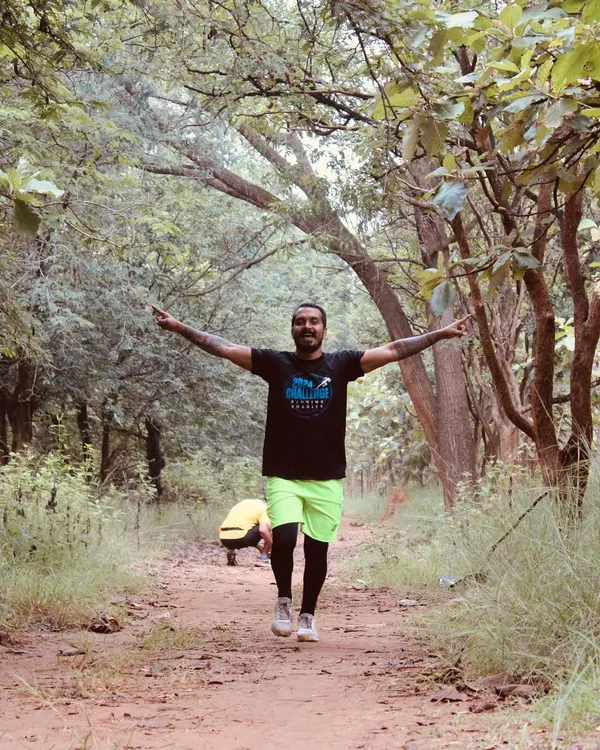 This is the feeling we chase. A runner embracing the freedom of the trail during our Hennur Bamboo Ultra. We design our courses to immerse you in nature, creating unforgettable moments of effort and joy.