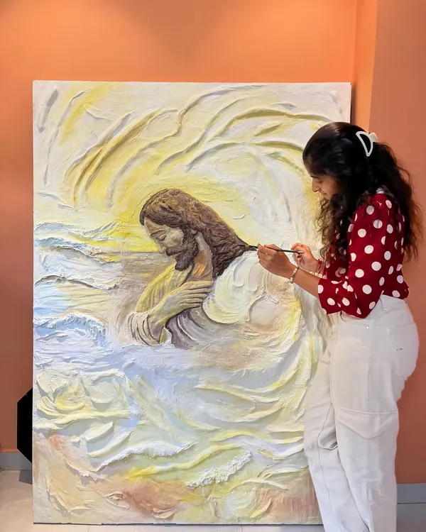 This is a close-up of my massive textured relief painting of Jesus. I spent over 50 hours meticulously sculpting and painting to capture a sense of peace and devotion. The physical effort of working with over 16 kgs of texture paste is a huge part of my process.