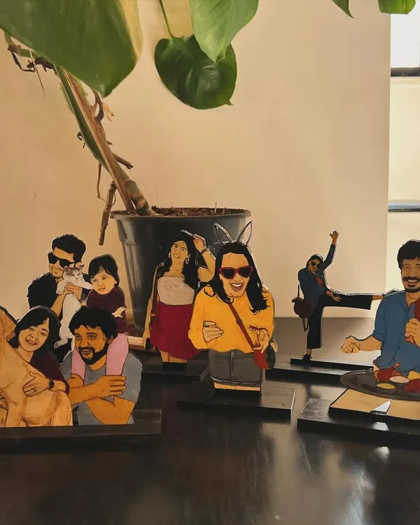 Here's a whole family of my custom wooden miniatures. I love creating these little scenes, capturing everything from family portraits with pets to fun, candid moments.
