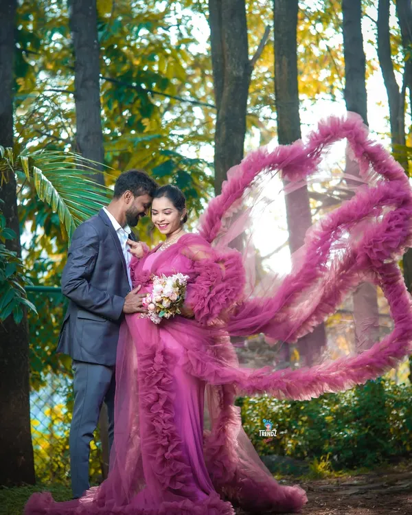 This outdoor maternity shoot in the woods with a stunning ruffled gown created a truly magical, fairytale moment for the expecting couple.