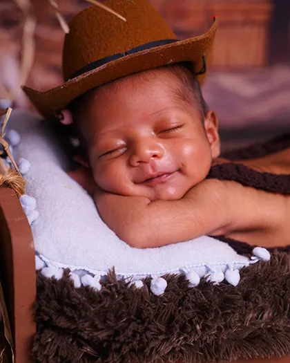 This little cowboy’s sleepy smile is why I love my job. Capturing these peaceful, dreamy moments in the first few days is my specialty. I make sure every baby is warm, safe, and comfortable.