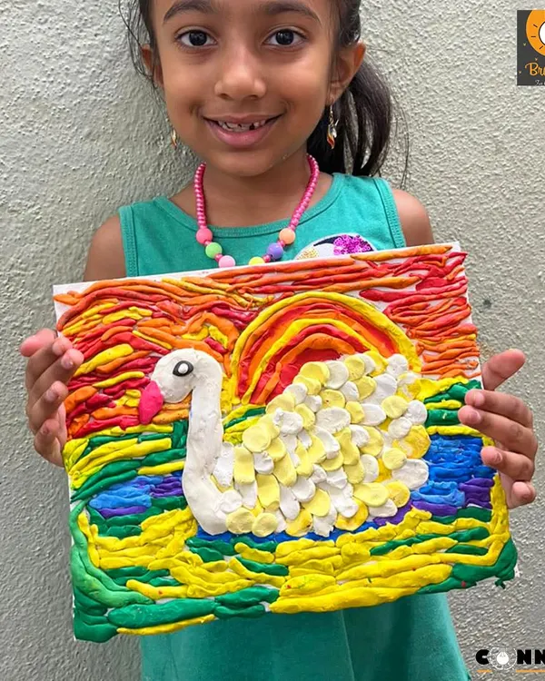 This vibrant swan was made entirely with playdough. Our sensory art classes for ages 3.5 to 5 focus on the process, allowing kids to squish, roll, and shape materials to build hand-eye coordination and self-expression.