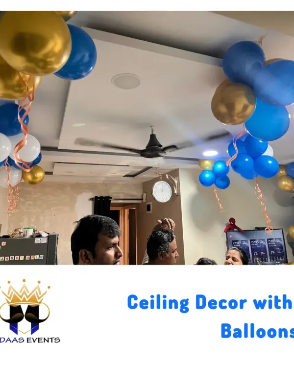 Simple yet effective ceiling decor with blue, gold, and white balloon bunches. This is an easy way to add a festive touch to any room for a home celebration.