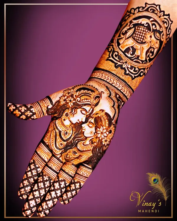 This design features a beautiful Radha Krishna portrait on the palm, complemented by a royal elephant on the wrist. I teach how to combine divine figures with other traditional motifs for a rich, layered look.